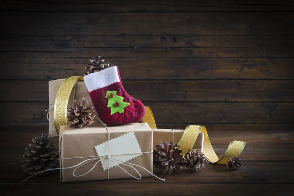 Christmas gifts on a wooden background — Stock Photo, Image