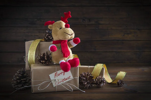 Christmas gifts on a wooden background — Stock Photo, Image