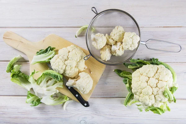 Raw cauliflower on the table of the kitchen — Stock Photo, Image