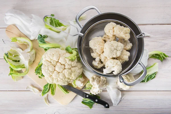 Raw cauliflower on the table of the kitchen — Stock Photo, Image