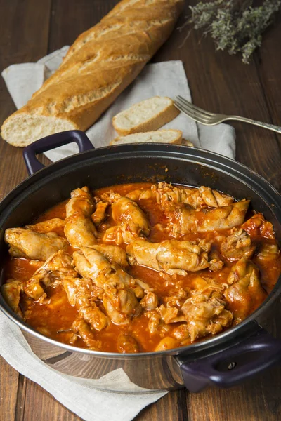 Crubeens with tomato sauce and bread — Stock Photo, Image