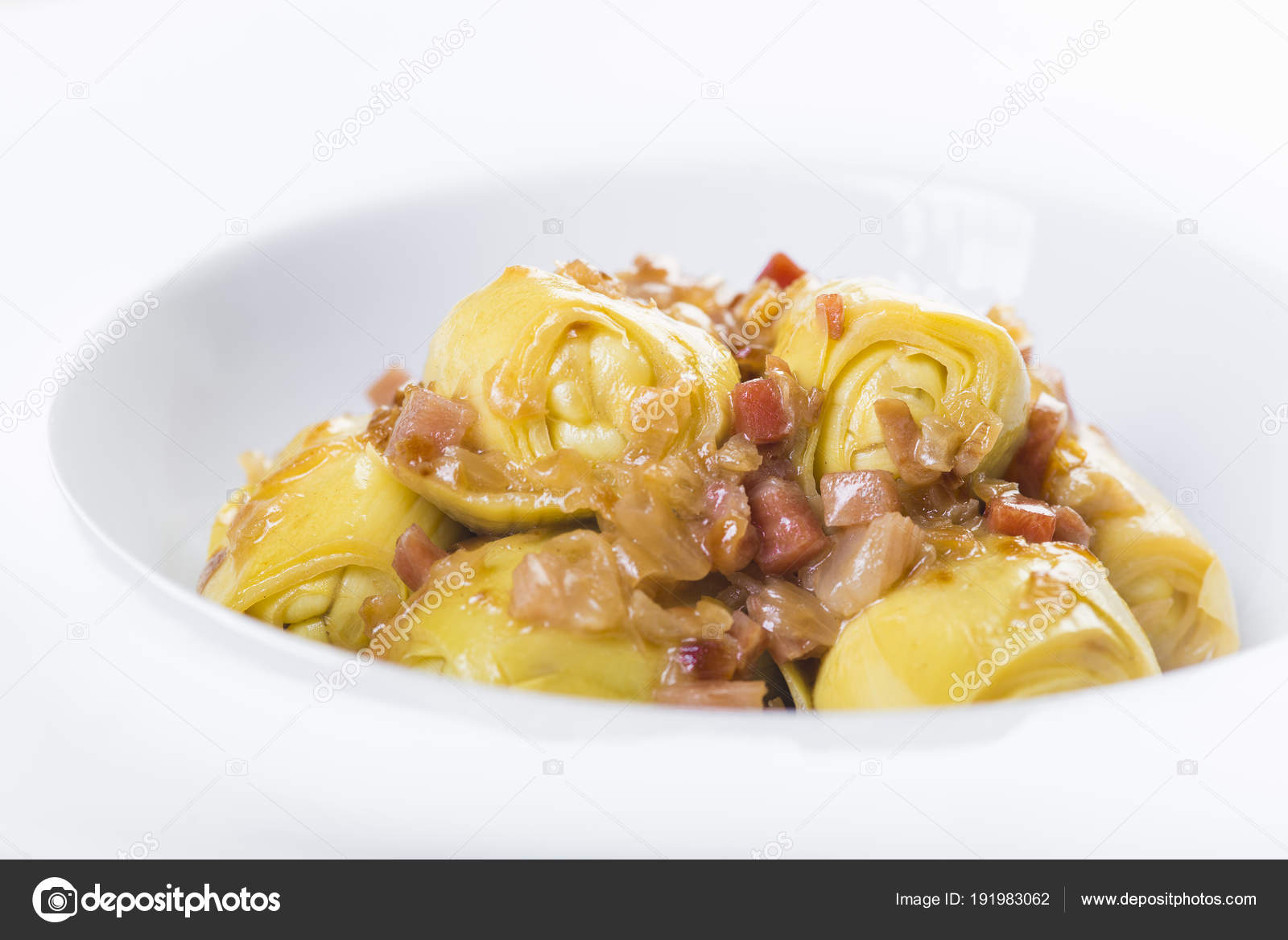 Sauteed artichoke hearts with ham Stock Photo by ©angelsimon 191983062
