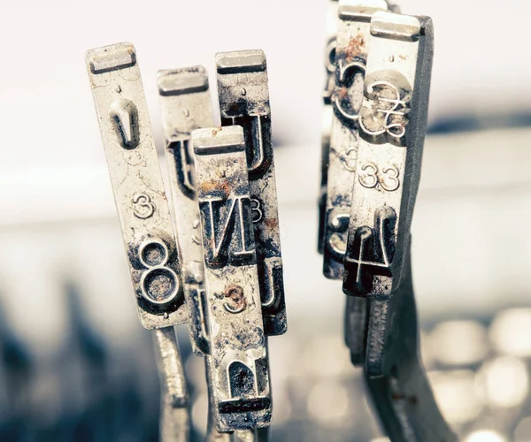 Old typewriter hammers macro — Stock Photo, Image