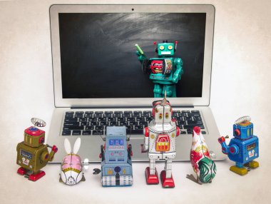 Robot techer çocuk robotlar öğretim bir laptop ekranında 