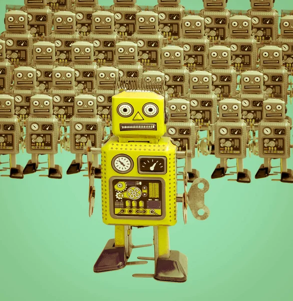 Little  yellow  robot is ahead of the crowd — Stock Photo, Image