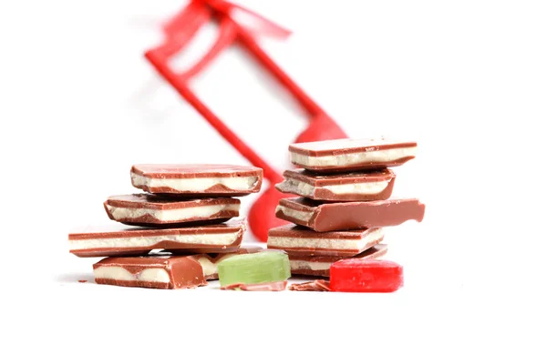 Chopped yoghurt chocolate bars on white — Stock Photo, Image