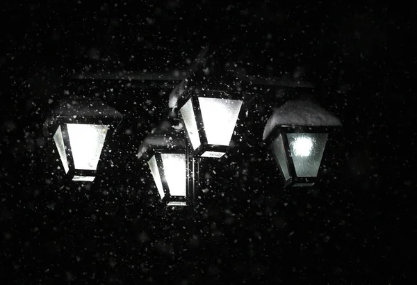 Snowing january night.street chandelier lights — ストック写真