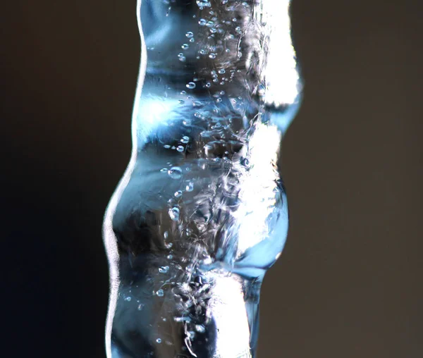 Shiny clear ice icicle hang on, macro shot — Stock Photo, Image