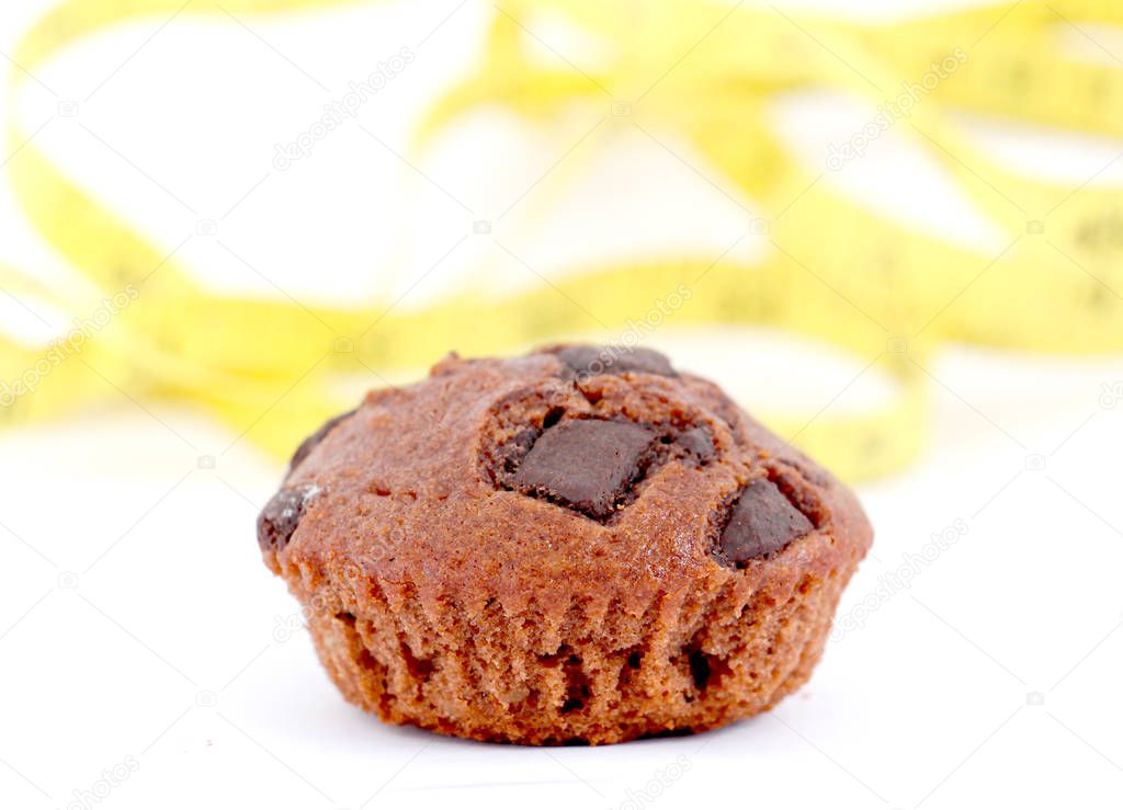 fresh baked chocolate muffin on white background