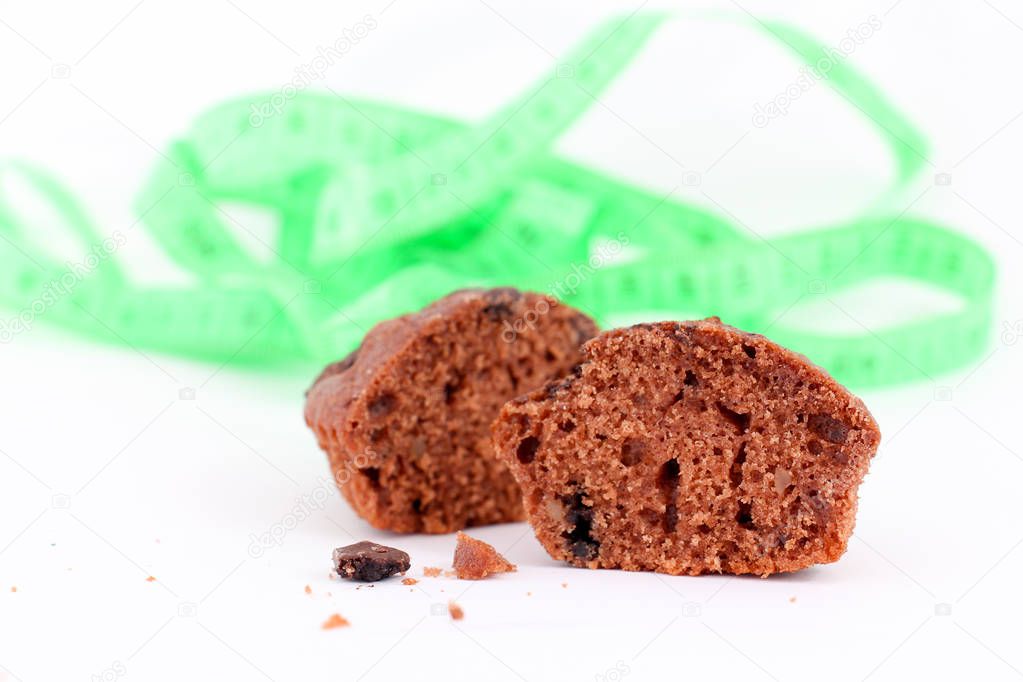 fresh baked chocolate muffin on white background