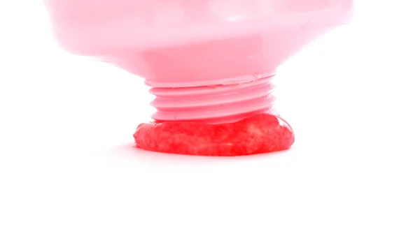 Chewing gum flows out from tube on white — Stock Photo, Image