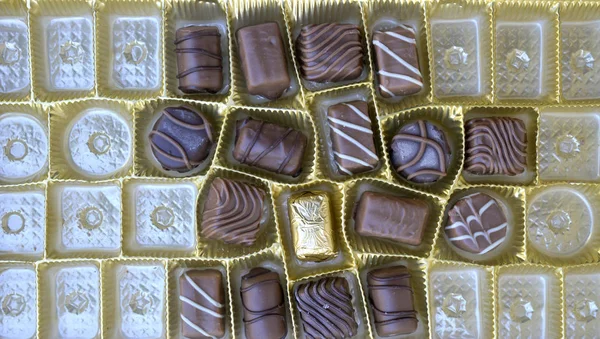 Různé čokoládové bonbony, pohled shora — Stock fotografie