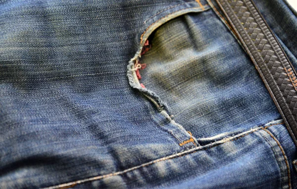 . Old grunge vintage denim jeans fashion design. Dark edged.Detail — Stock Photo, Image