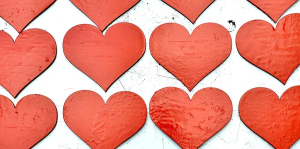 Wooden red painted hearts on white background — Stock Photo, Image