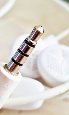 wired earbuds plug , macro shot