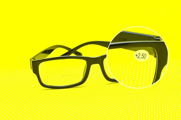 Prescription Black Eyeglasses Yellow Background Magnifier — Stock Photo, Image