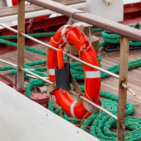 Lifebuoy on a  yacht side — Stock Photo, Image