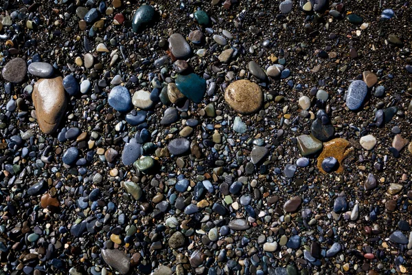 Fundo de pedras marinhas. seixos de praia. pedras na praia — Fotografia de Stock