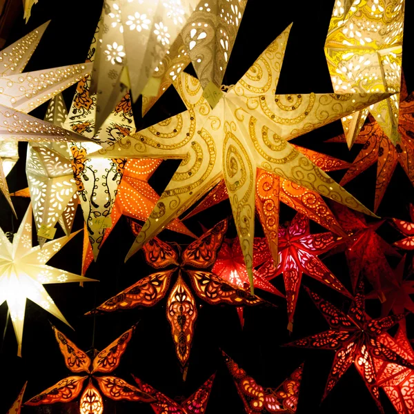 Colorful Christmas stars. A background of star lanterns — Stock Photo, Image