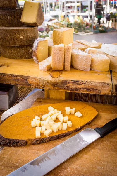 Piece of cheese. cheese on a wooden table with knife — Stock Photo, Image
