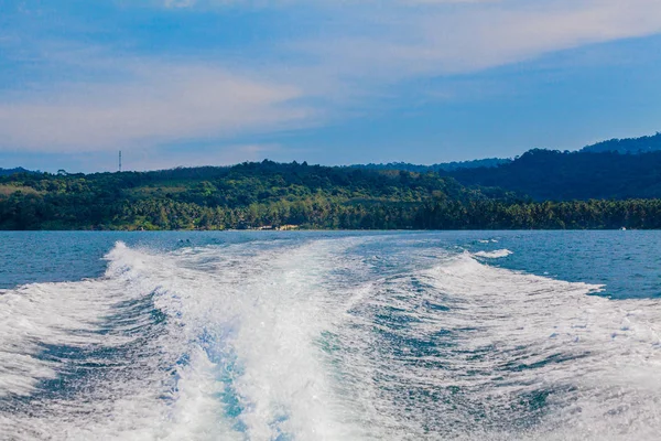 Water stream after speed boat.  Trail on water surface behind of — Stock Photo, Image