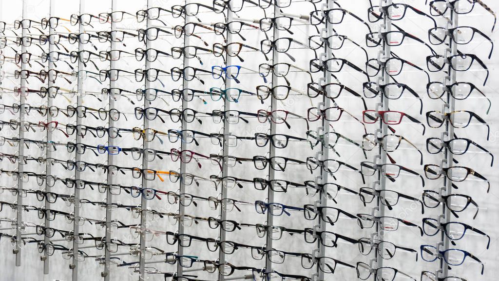 glasses background. glasses displayed. eye glasses on the shelf.