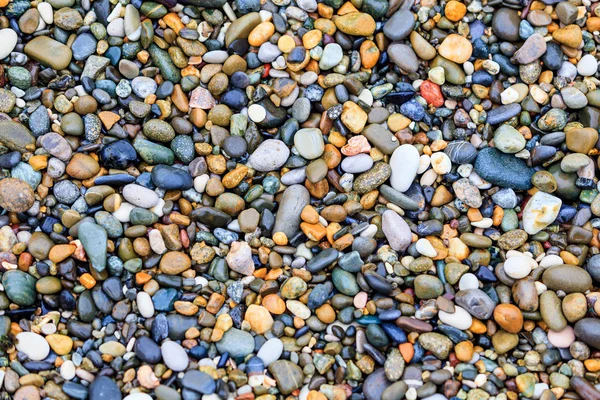 Pietre sulla spiaggia. sfondo di pietra — Foto Stock