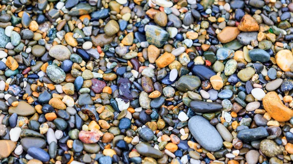 Kamienie na plaży. kamienne podłoże — Zdjęcie stockowe