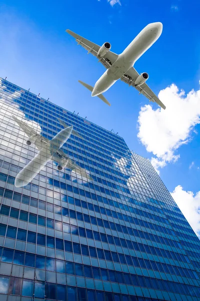 Aeroplane flying over the skyscrapers. architecture building wit — Stock Photo, Image