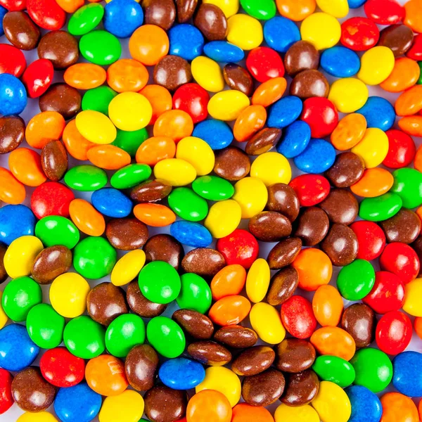 Doces coloridos. Chocolate colorido doce para fundos — Fotografia de Stock