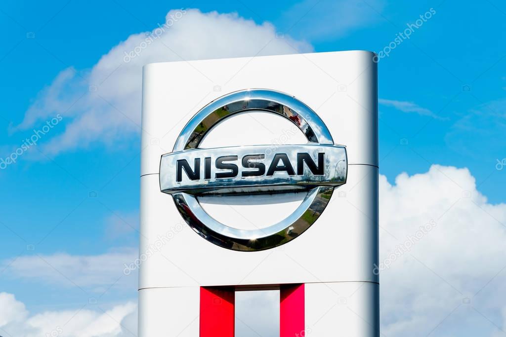 GERMANY, MOENCHENGLADBACH -APRIL 16, 2017: Logotype of Nissan corporation. Nissan company logo on dealership building