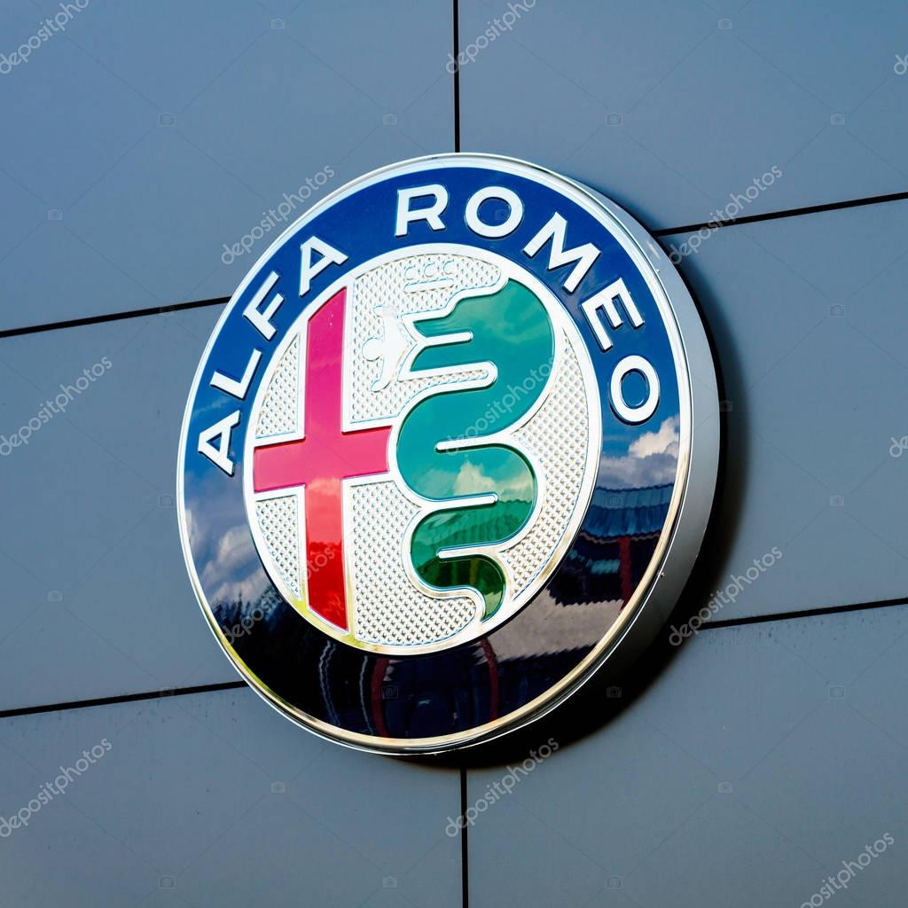 GERMANY, MOENCHENGLADBACH -APRIL 16, 2017: Logotype of Alfa Romeo corporation. Alfa Romeo company logo on dealership building