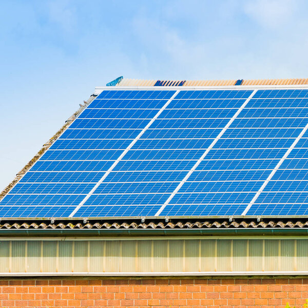Solar panel on a roof of a house.  alternative energy photovolta
