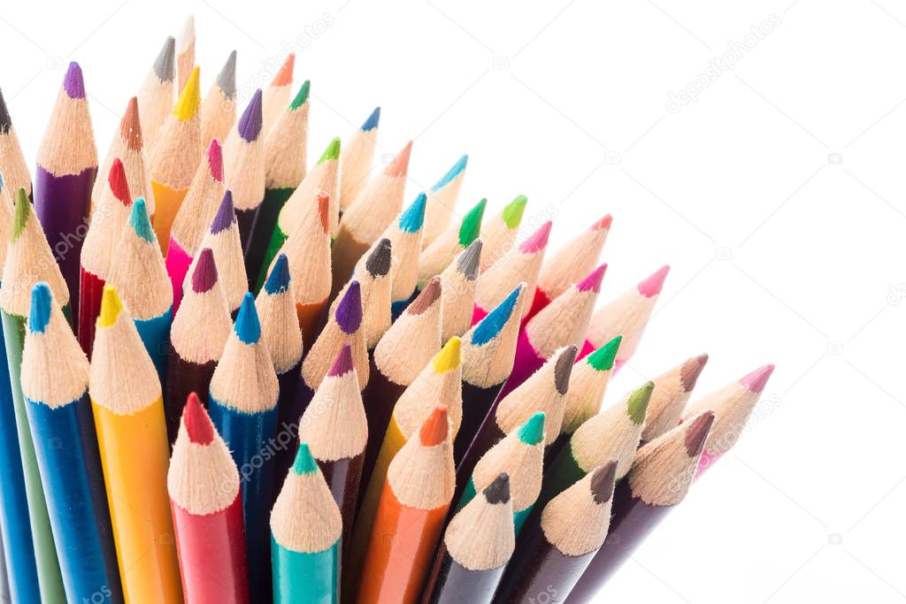 close up of colour pencils isolated on white background. many co