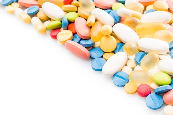 Borde de píldoras de colores. pastillas y medicamentos — Foto de Stock