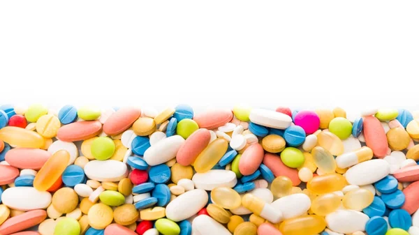 Borde de píldoras de colores. pastillas y medicamentos — Foto de Stock