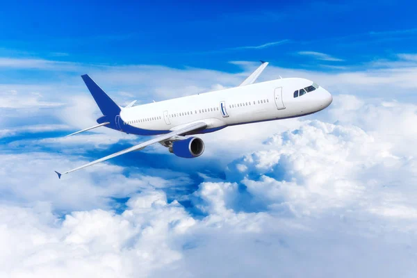 Airplane over the clouds — Stock Photo, Image