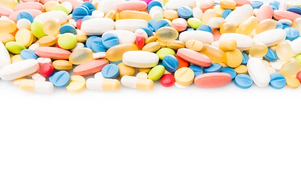 Borde de píldoras de colores. pastillas y medicamentos — Foto de Stock