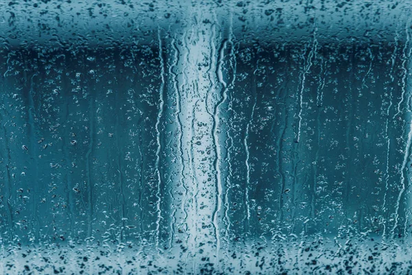 Lluvia sobre vidrio. Gotas de lluvia en la ventana —  Fotos de Stock
