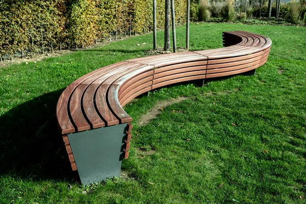 A modern bench  in a city park on a sunny day — Stock Photo, Image