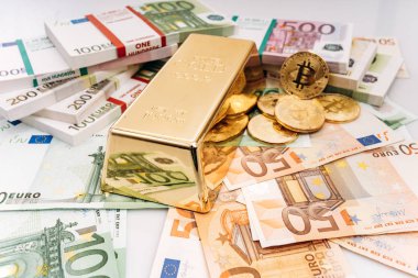 Bitcoin BTC Gold coins with bills of euro banknotes and gold bullion. Bitcoin and gold lie on Euro banknotes clipart