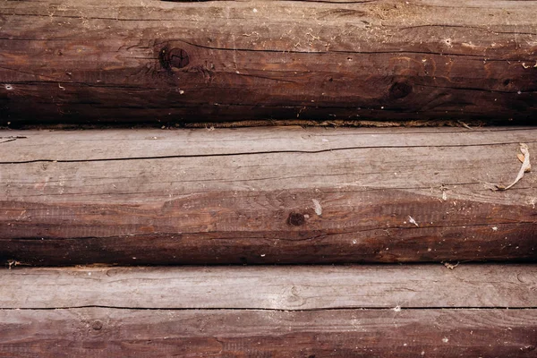 Wooden logs wall of rural house background. The texture of the logs. Background of logs. — Stock Photo, Image