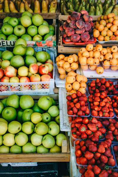 Fresh fruit in the market. Apricots, peaches, cherries, apples