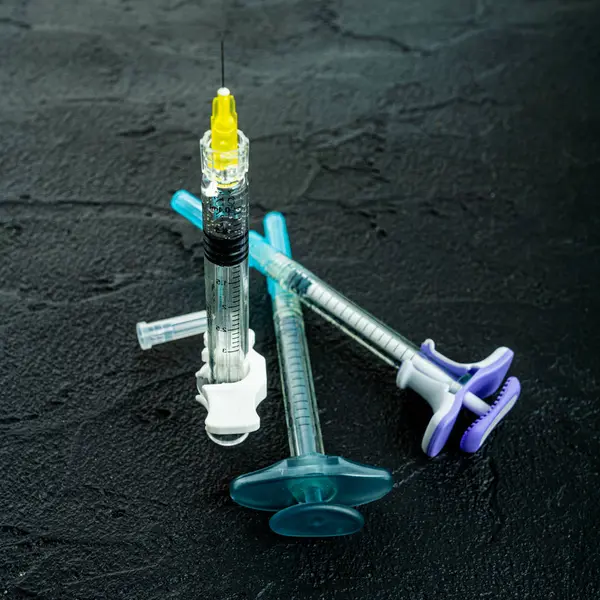 Syringe medical injection on black background — Stock Photo, Image