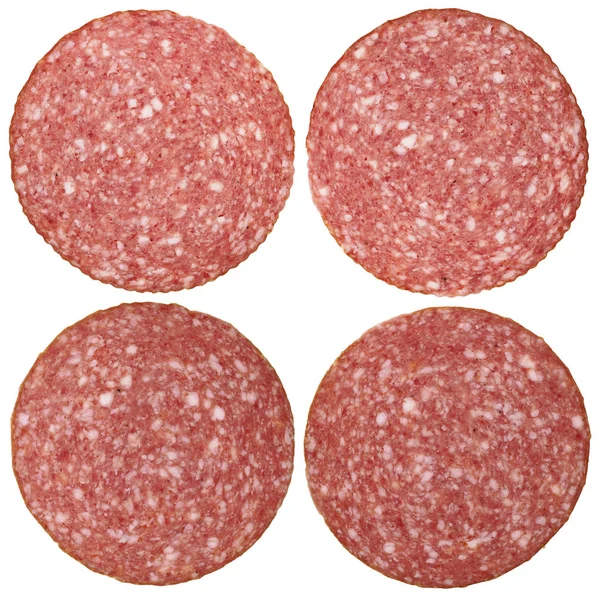 Vier ronde stukjes van een salami — Stockfoto