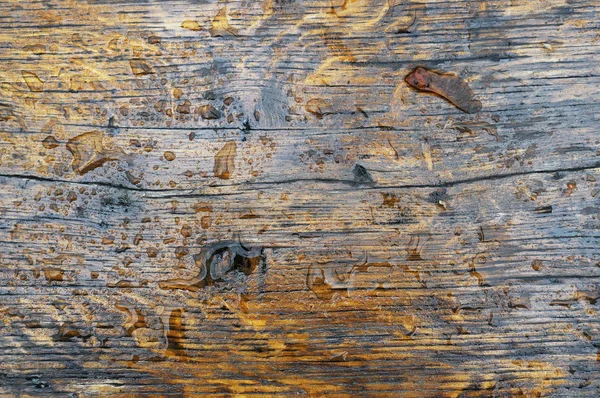 Drops on the varnished wooden oak surface — Stock Photo, Image