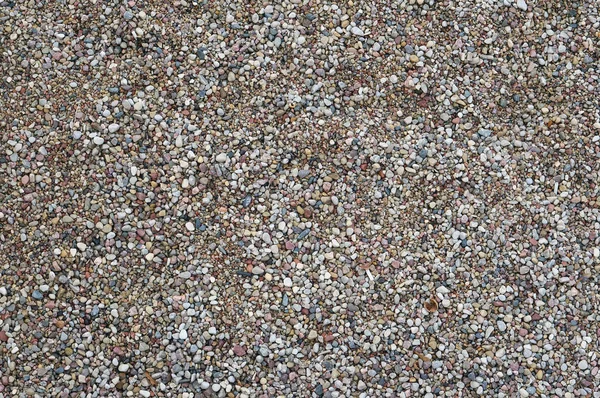 Pequeno cascalho de granito redondo molhado — Fotografia de Stock