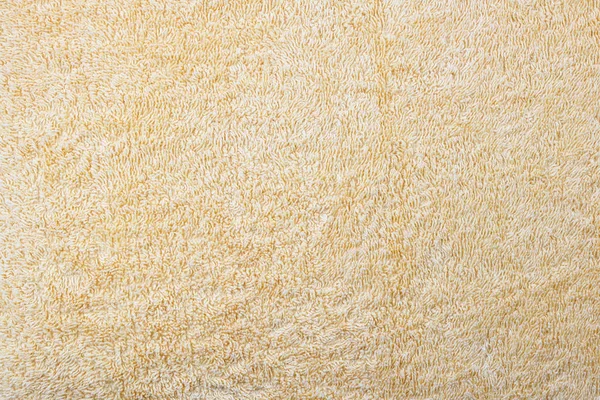 Die Oberfläche eines gelben Frotteehandtuchs — Stockfoto