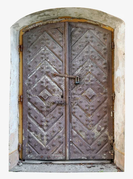 Locked rotten door to the dungeon of a medieval ruined castle co — Stock Photo, Image