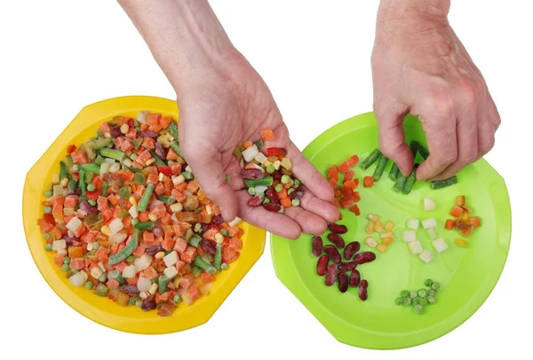 Frozen "Mexican" vegetable mix sorting with hands isolated — Stock Photo, Image